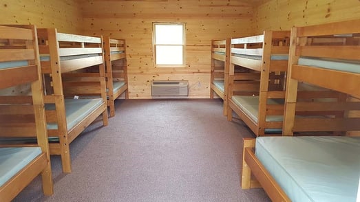 Image of a summer camp bunkbed.